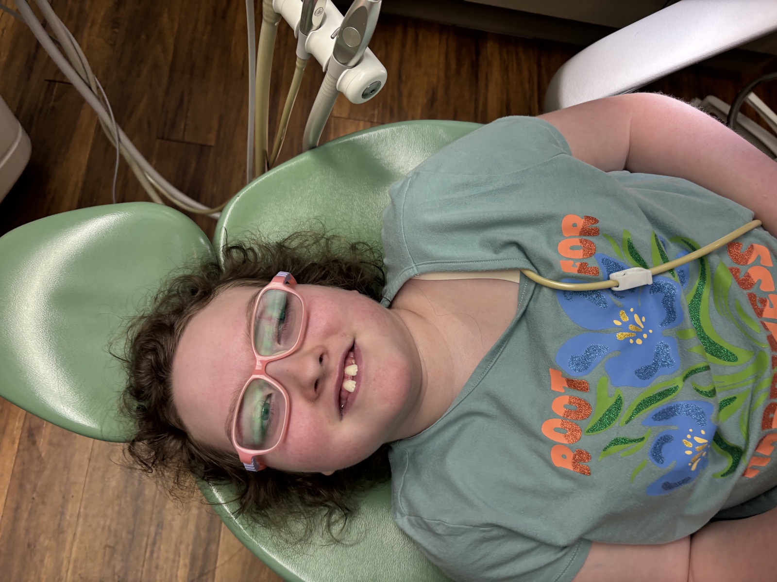 Sophia smiling during a dental appointment in 2026