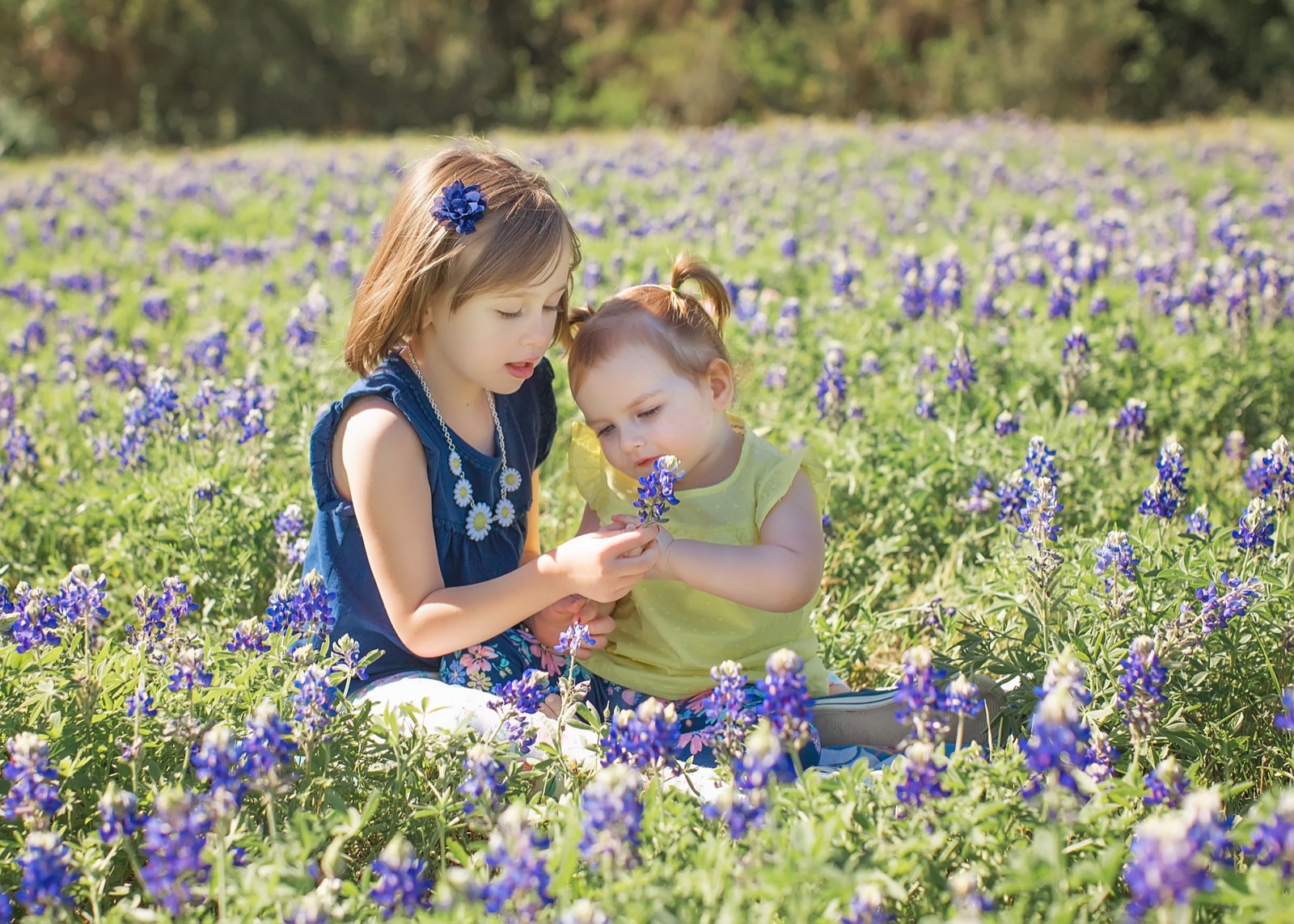 Sophia with Isabella in a field of bluebonnets in 2017