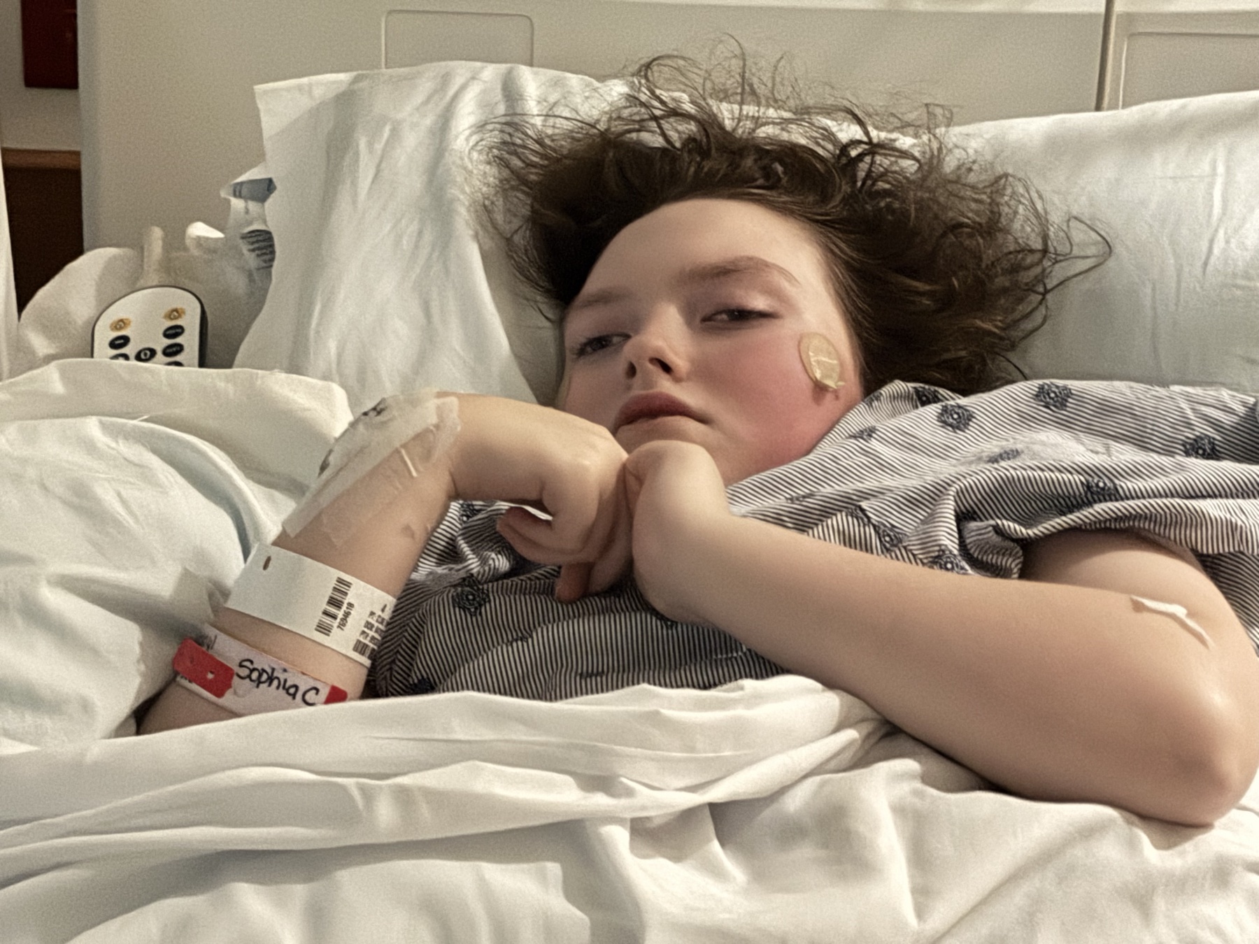 Sophia recovering in the hospital after her hip procedure in 2026